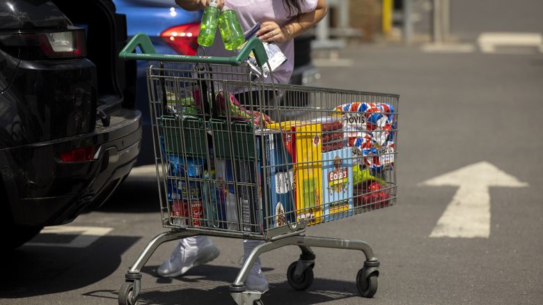 A shopper packs groceries into their car boot at a Morrisons supermarket, operated by Wm Morrison Supermarkets Plc, in Welling, Greater London, UK, on Monday, June 19, 2023.