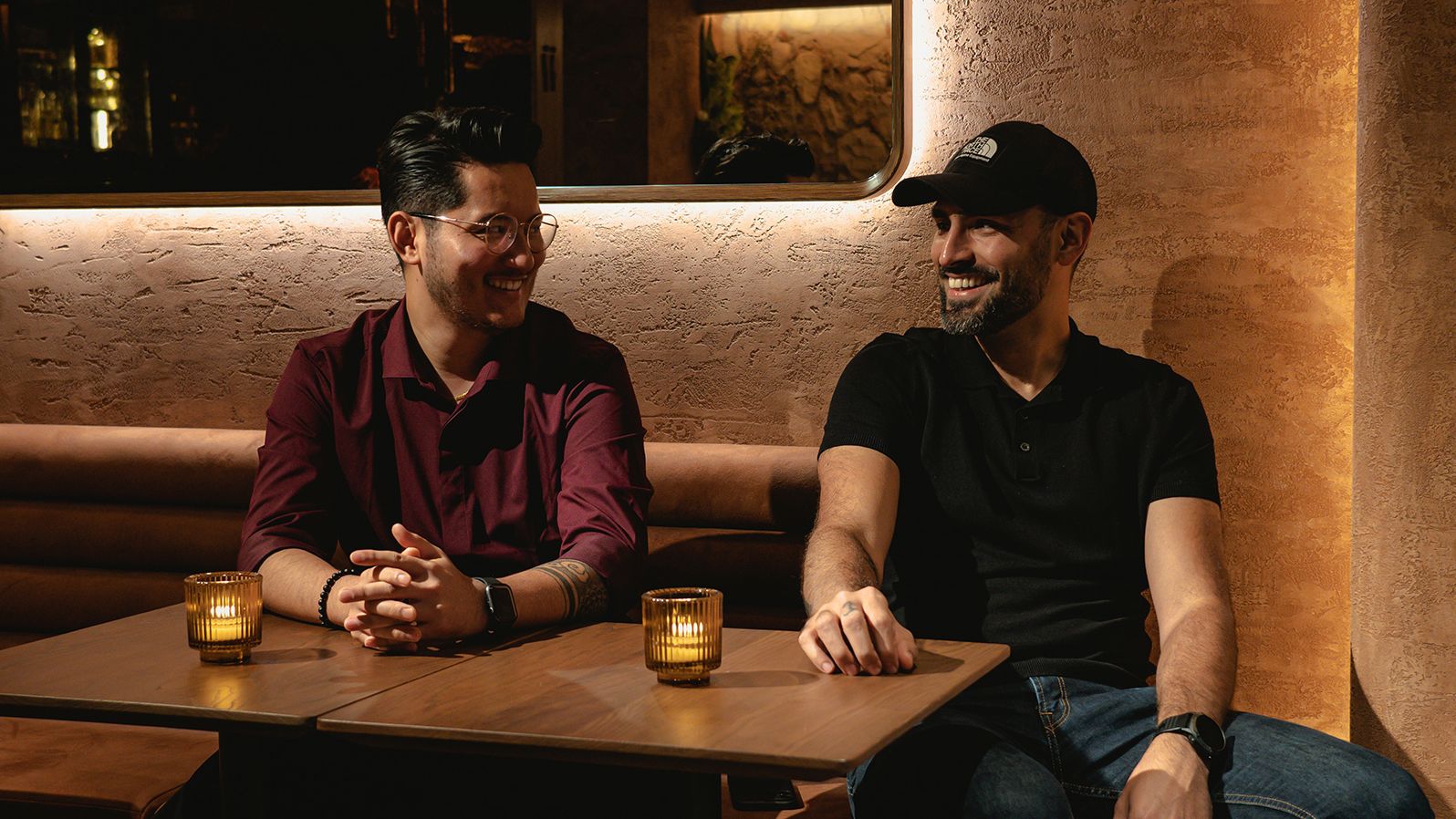 From left, Ajit Gurung and Jay Khan pose for pictures at the Savory Project cocktail bar in Hong Kong on June 8, 2023.