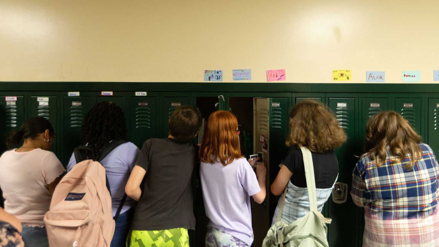 Sixth-grade students in Topeka, Kansas, set up their lockers on the first day of classes in August 2022. 