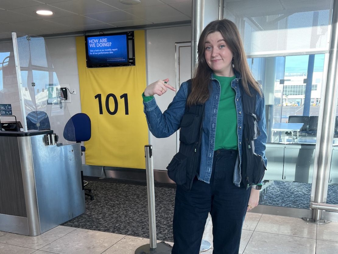 Here's Chelsea Dickenson at an airport, modeling the fishing vest stuffed with extra clothes.