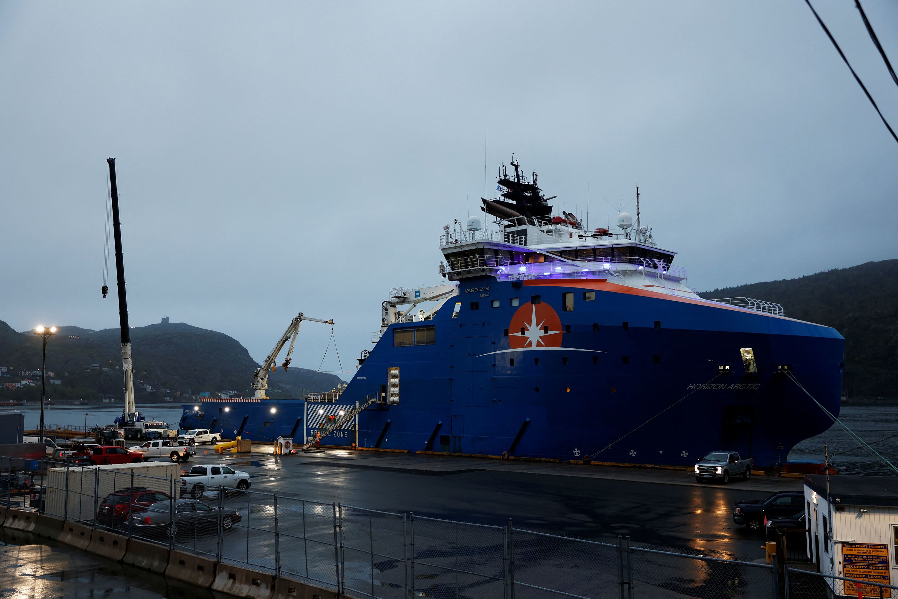 Equipment flown in by US Air Force transport planes is loaded onto the offshore vessel Horizon Arctic before its deployment to the search area.