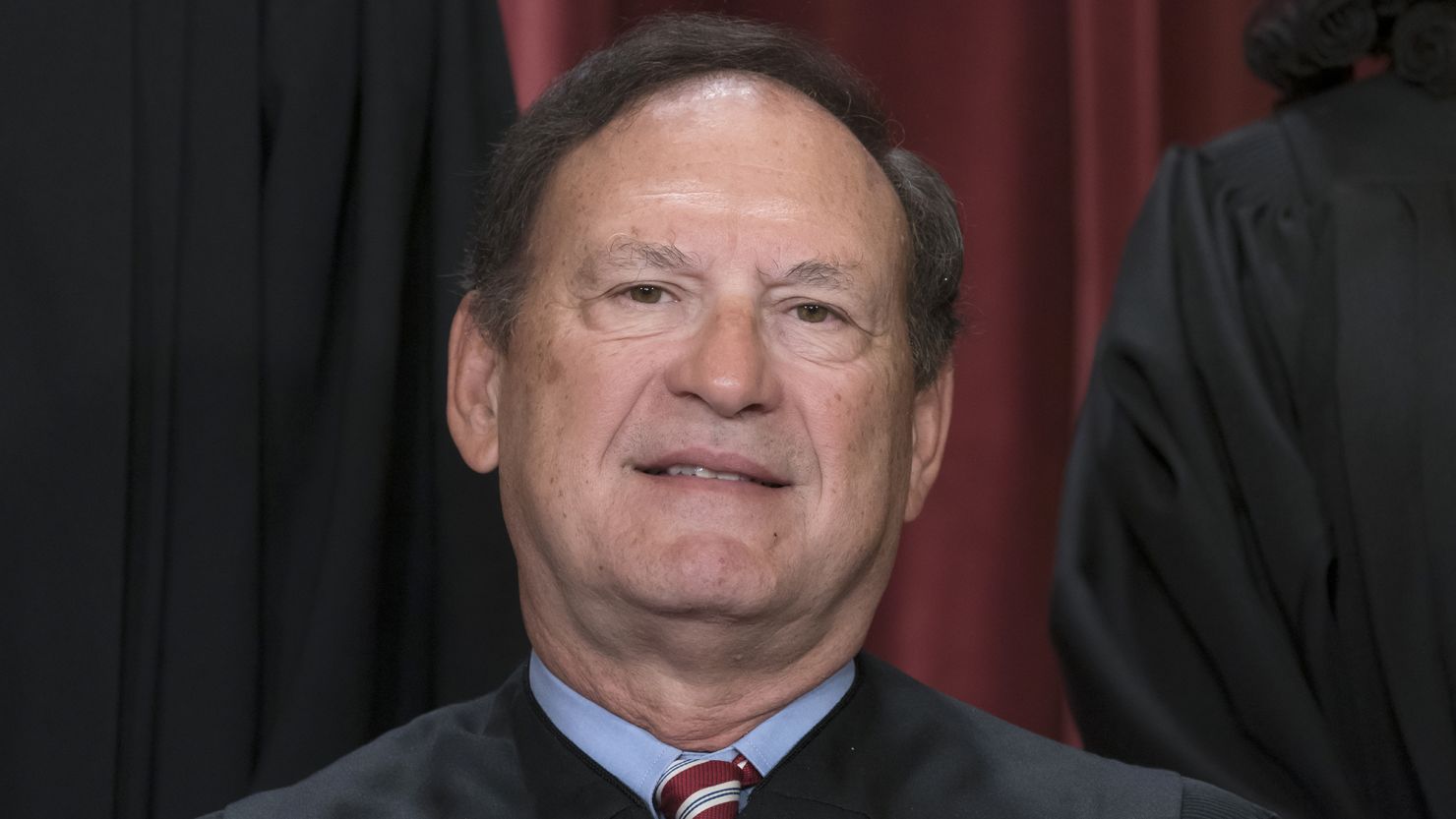 Associate Justice Samuel Alito joins other members of the Supreme Court as they pose for a new group portrait, at the Supreme Court building in Washington on October 7, 2022. 