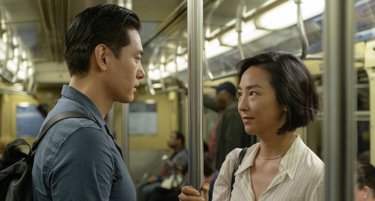 Teo Yoo and Greta Lee as childhood friends reunited in "Past Lives."