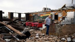 Pat Smith looks through his restaurant, Matador Diner, after a tornado, Thursday, June 22, 2023, in Matador, Texas. Smith was in the cafe during the tornado and "It felt like forever but only lasted 20 seconds." A line of severe storms produced what a meteorologist calls a rare combination of multiple tornadoes, hurricane-force winds and softball-sized hail in west Texas, killing at least four people and causing significant damage around the town of Matador, a meteorologist said Thursday. (Annie Rice/Lubbock Avalanche-Journal via AP)