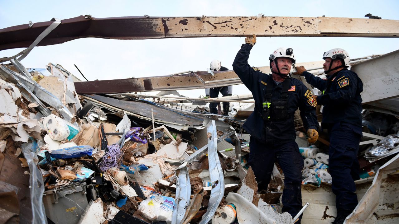 Search and rescue teams look for survivors in a former Dollar General after a tornado in Matador, Texas, on June 22, 2023.