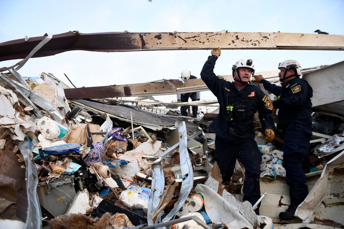 Search and rescue teams look for survivors in a former Dollar General after a tornado in Matador, Texas, on June 22, 2023.