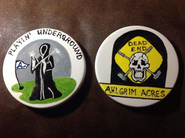 A variety of homemade Ahlgrim Acres merchandise is available to buy, including shirts and badges.