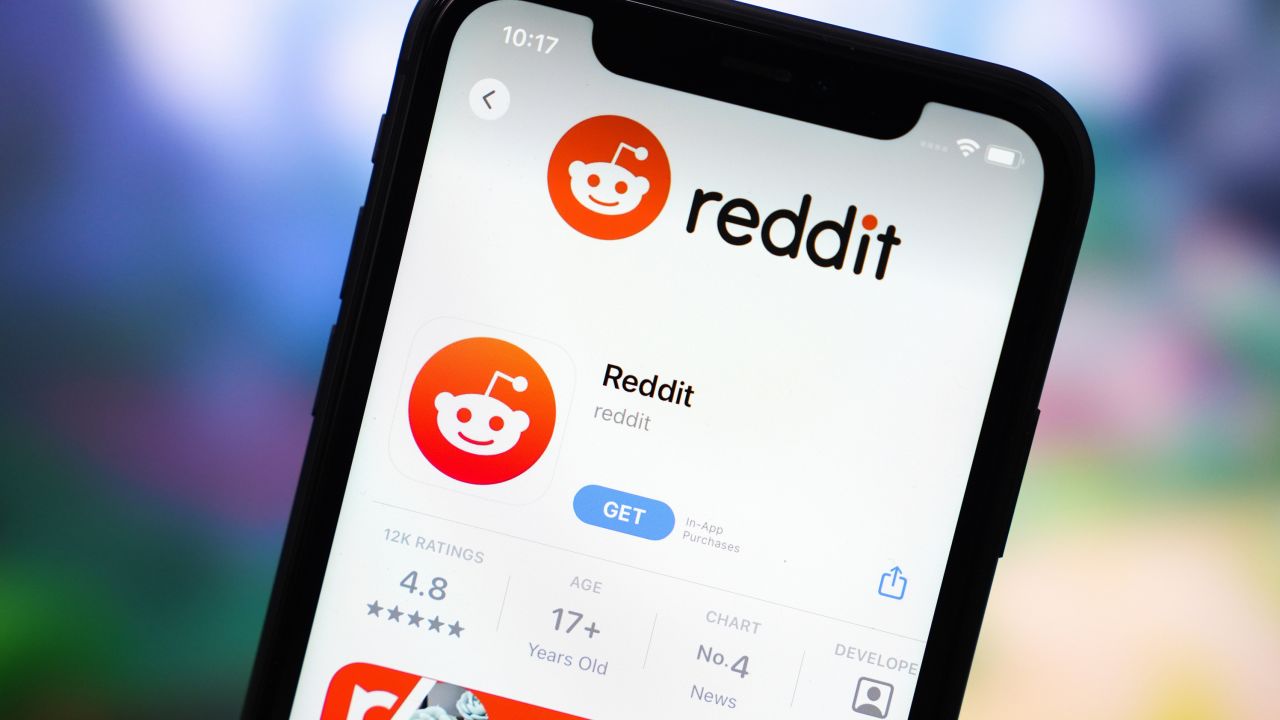In this photo illustration, the Reddit app logo is displayed in the App Store on an iPhone.
