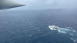 A Coast Guard Air Station Elizabeth City, North Carolina HC-130 Hercules airplane flies over the French research vessel, L'Atalante approximately 900 miles East of Cape Cod during the search for the 21-foot submersible, Titan, June 21, 2023. The unified command is searching for five people after the Canadian research vessel Polar Prince lost contact with their submersible during a dive June 18, 2023.