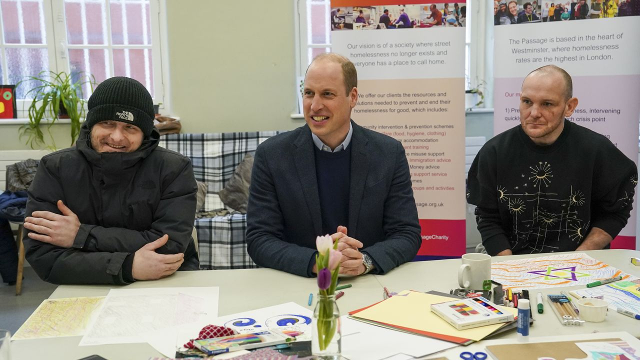 William sits with residents Gary and Marc during a visit to London homeless charity The Passage on February 23, 2023. 
