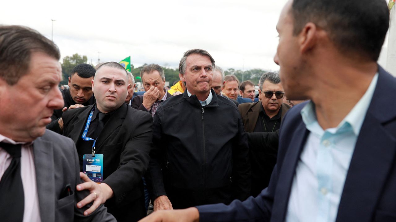 Brazil's former President Jair Bolsonaro meets with supporters at the 23rd Fair and Congress of Transport and Logistics, on the day the Electoral Justice begins the trial to determine his political rights, as he arrives in Porto Alegre, Rio Grande do Sul, Brazil, June 22, 2023. 