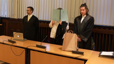 11 January 2023, Rhineland-Palatinate, Koblenz: The 37-year-old defendant (M) stands between her lawyers in the courtroom of the Higher Regional Court. She is accused of keeping a Yazidi woman as a slave and committing other crimes. The trial against the alleged IS supporter began on Wednesday at the Koblenz Higher Regional Court. (To dpa "Trial begins against suspected IS supporter and slave owner") Photo: Thomas Frey/dpa (Photo by Thomas Frey/picture alliance via Getty Images)