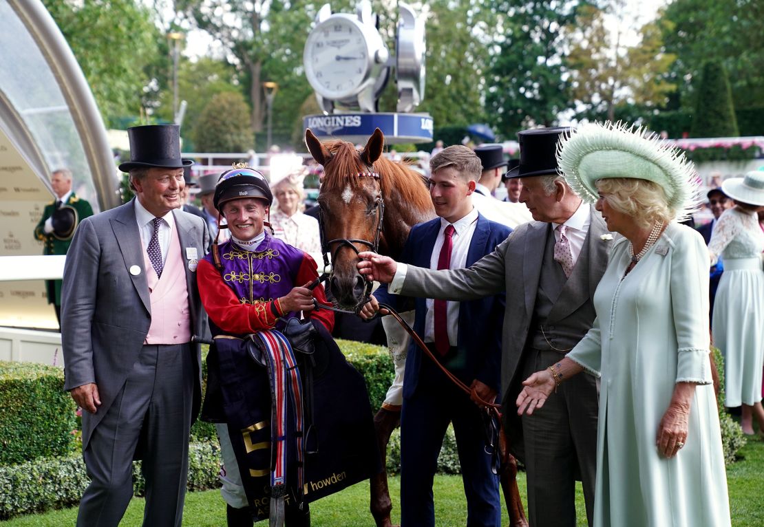 King Charles III and Queen Camilla, owners of Desert Hero ridden by Tom Marquand (second left), and trained by William Haggas (left) following victory in the King George V Stakes on day three of Royal Ascot at Ascot Racecourse, Berkshire. Picture date: Thursday June 22, 2023. (Photo by John Walton/PA Images via Getty Images)