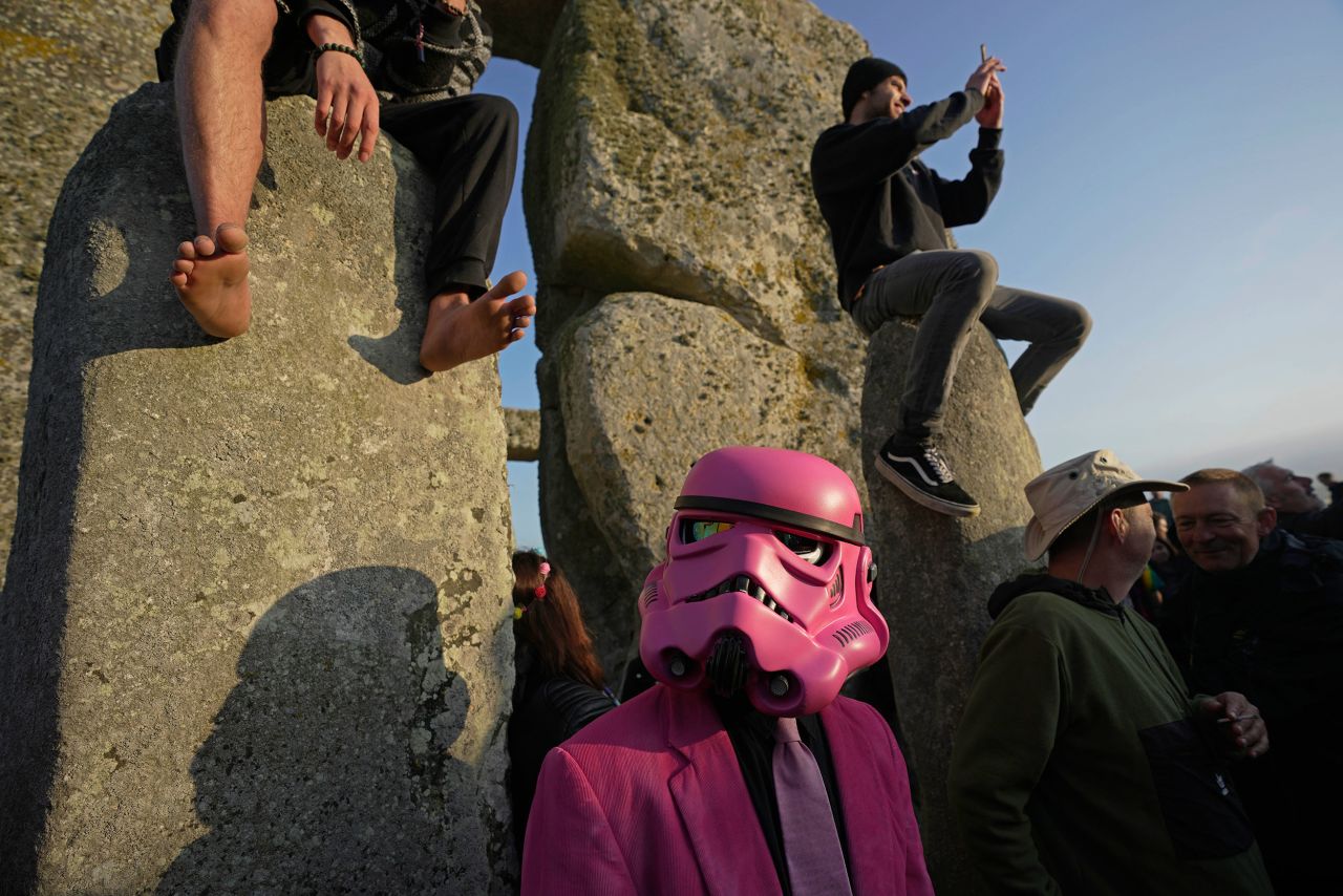 Revelers gather at Stonehenge to celebrate the <a href="https://www.cnn.com/travel/summer-solstice-celebrations-traditions-world-scn/index.html" target="_blank">summer solstice</a>, the longest day in the Northern Hemisphere, near Salisbury, England, on Wednesday, June 21.