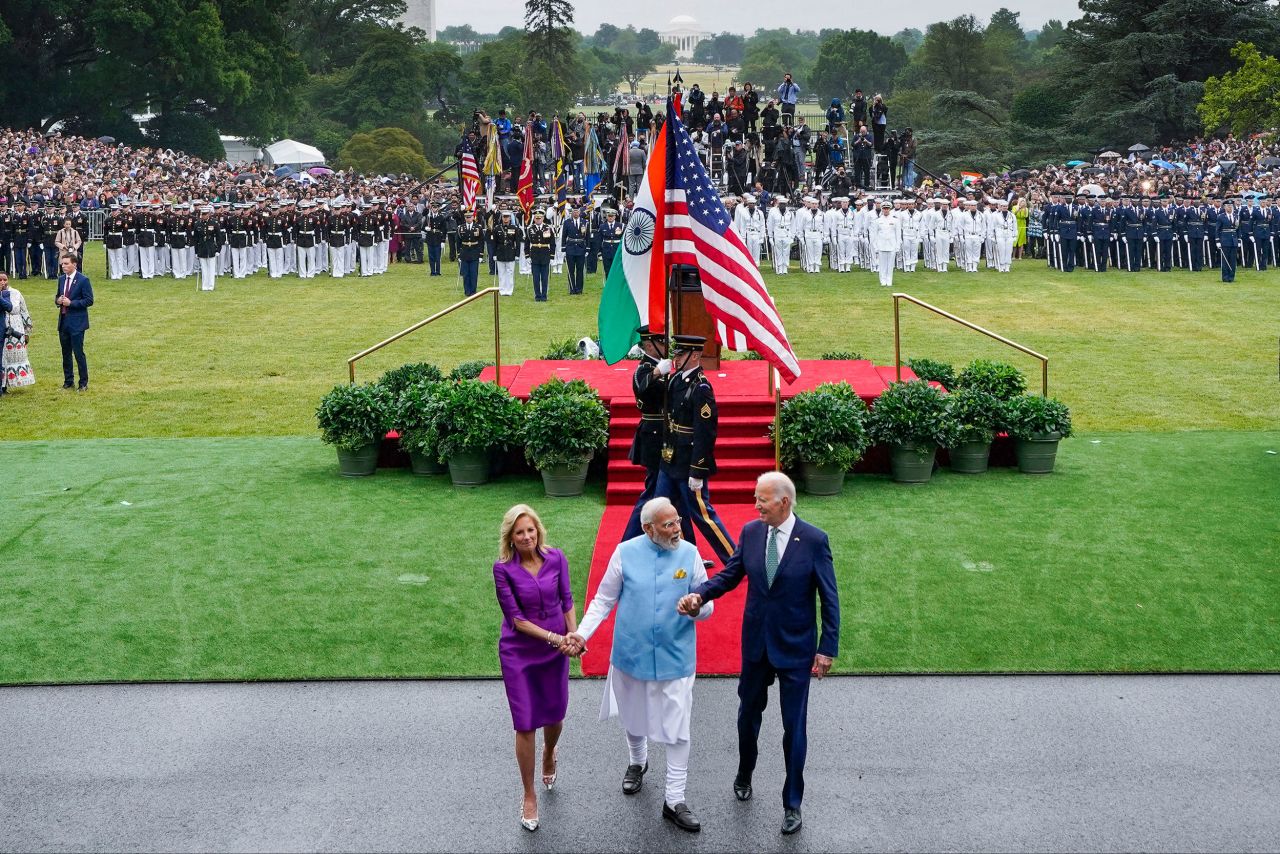 Indian Prime Minister Narendra Modi, center, holds hands with US President Joe Biden and first lady Jill Biden after an arrival ceremony at the White House on Thursday, June 22. <a href="https://www.cnn.com/2023/06/21/politics/joe-biden-narendra-modi-visit/index.html" target="_blank">The Bidens were hosting Modi</a> for a state dinner on Thursday night.