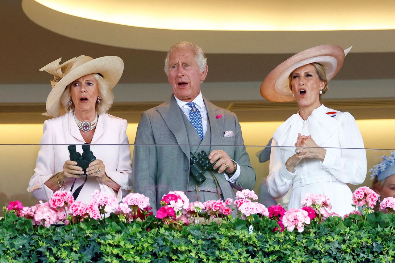 From left, Britain's Queen Camilla, King Charles III and Sophie, Duchess of Edinburgh, react while watching a horse race at the Royal Ascot on Wednesday, June 21. One of the King's horses also <a href="https://www.cnn.com/2023/06/22/sport/king-charles-royal-ascot-winner-spt-intl/index.html" target="_blank">won a race</a> at the prestigious event.
