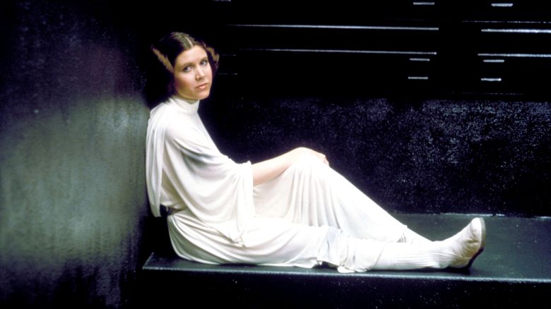 Editorial use only. No book cover usage.Mandatory Credit: Photo by Lucasfilm/Fox/Kobal/Shutterstock (5886297ff)Carrie FisherStar Wars Episode IV - A New Hope - 1977Director: George LucasLucasfilm/20th Century FoxUSAFilm PortraitScifiStar Wars (1977)La Guerre des étoiles