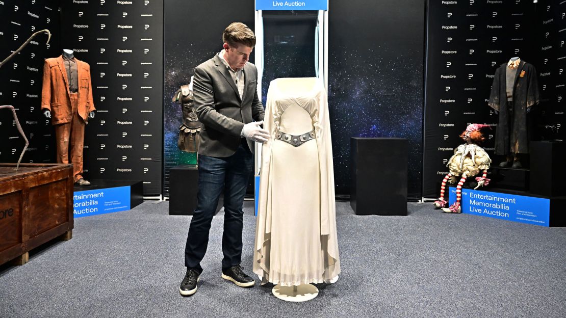 Brandon Alinger, Chief Operating Officer at Propstore, in May putting on display the Princess Leia dress worn by Carrie Fisher in 1977's "Star Wars: A New Hope."  