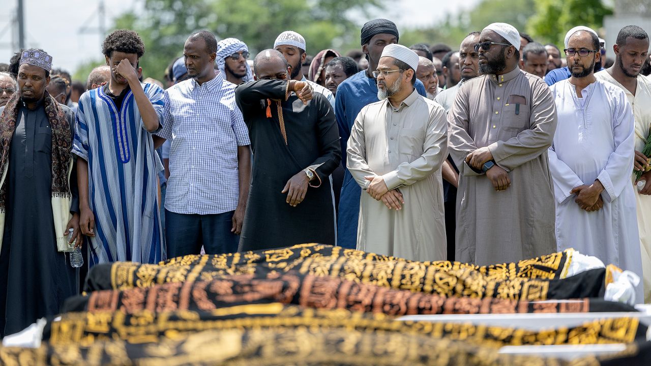 Men mourn the five women killed in a car crash, during the funeral at the Dar Al-Farooq Islamic Center in Bloomington, Minnesota, on Monday, June 19, 2023.