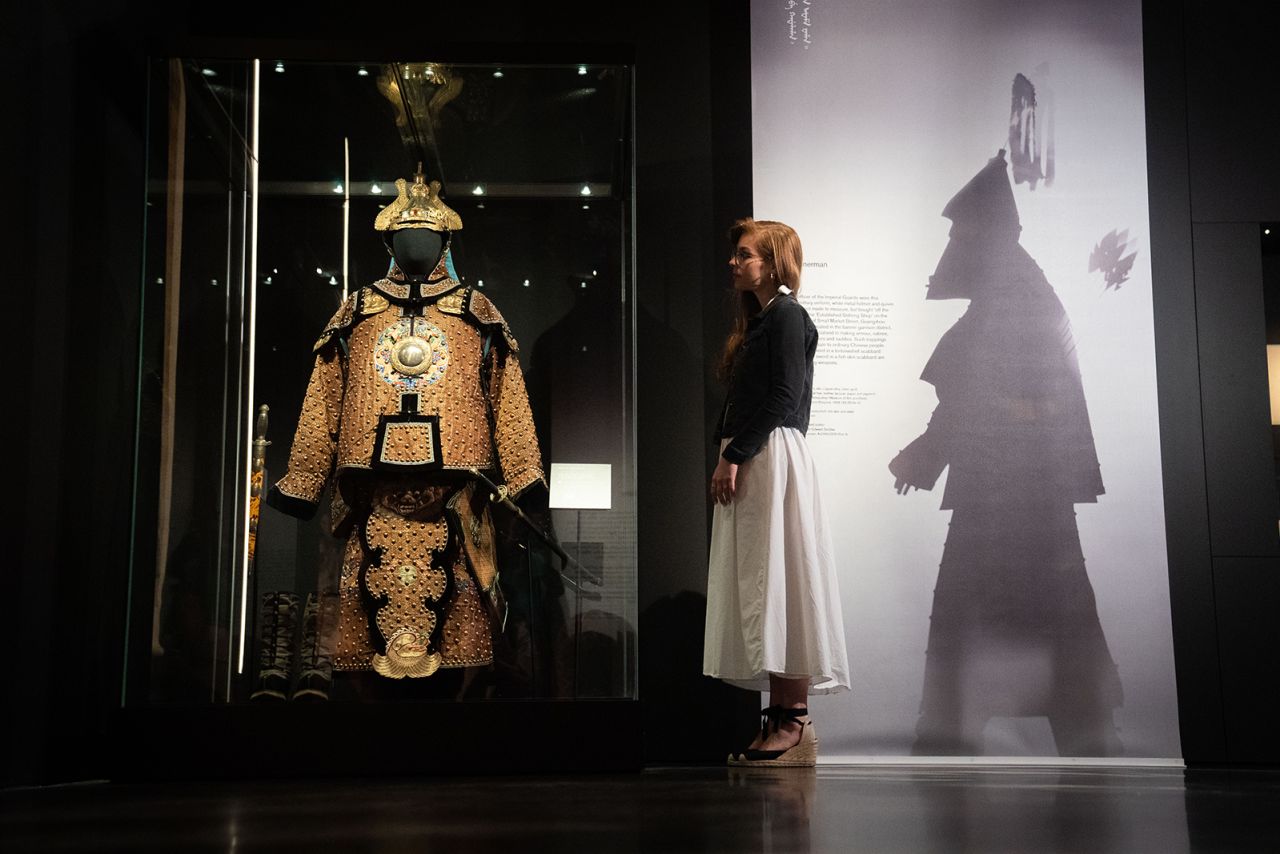 A British Museum worker pictured in the "China's hidden century" exhibition ahead of its public opening.