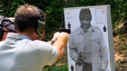 In an image taken from a video, a person fires a gun during a training course held by the Villa Rica Police Department in Georgia.