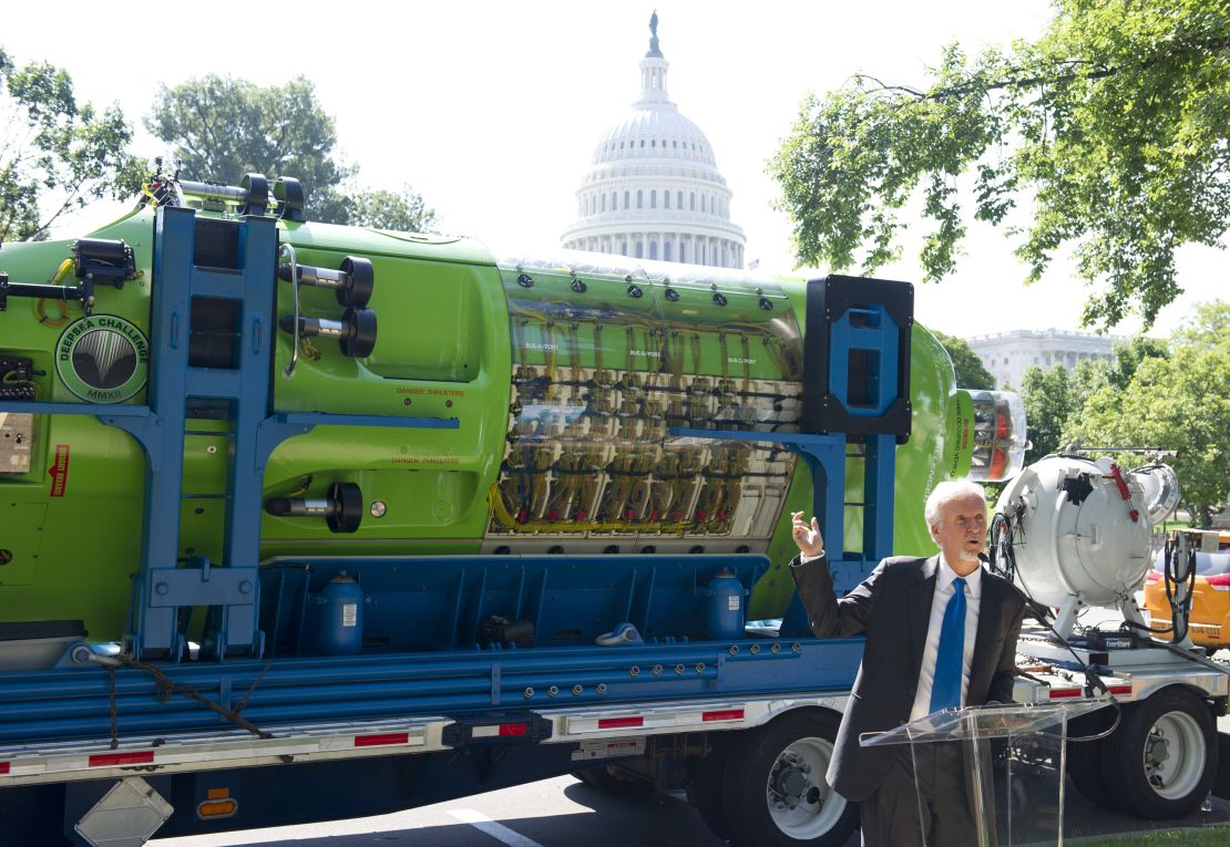 James Cameron speaks in front of the one-person submarine he helped develop, "Deepsea Challenger," in 2013.