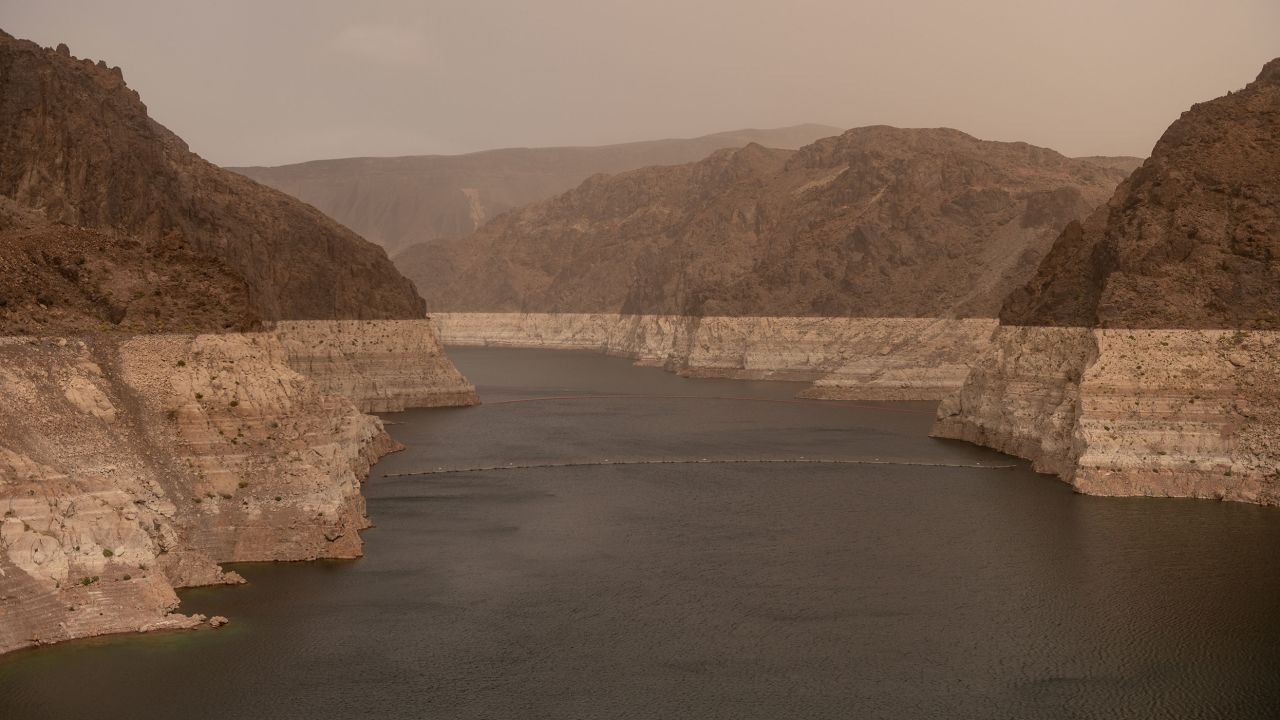 Bathtub rings, showing how far the water level has dropped, are seen along the banks of Lake Mead near the Hoover Dam in April 2023.