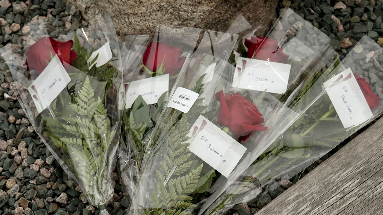Flowers are placed at King's Beach at the port of St John's in Newfoundland, Canada, for each of the five men who died when the Titan submersible suffered a catastrophic implosion.