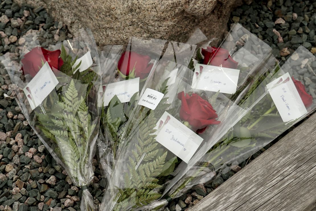 Flowers are placed at King's Beach at the port of St John's in Newfoundland, Canada, for each of the five men who died when the Titan submersible suffered a catastrophic implosion.