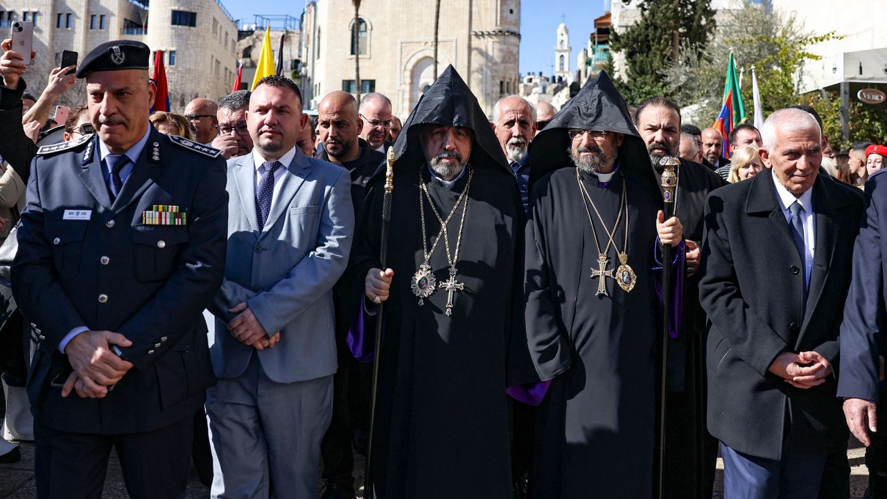 Patriarch Nurhan Manougian (C) of the Armenian Patriarchate of Jerusalem arrives to the Church of the Nativity in the occupied West Bank city of Bethlehem, to celebrate the Nativity of Jesus, on January 18. 