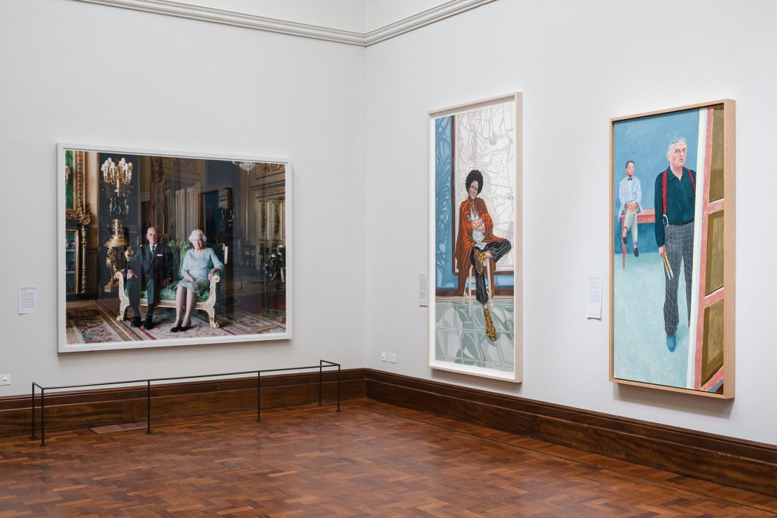 Prince Philip, Duke of Edinburgh and Queen Elizabeth II by Thomas Struth, left, Sadie (Zadie Smith) by Toyin Ojih Odutola, center, and Self-Portrait with Charlie by David Hockney, exhibited inside the newly opened Weston Wing at the National Portrait Gallery in London, UK, on Monday, June 19, 2023. After three years and more than £40 million spent, the UK's preeminent portrait gallery has new stories to tell. Photographer: Carlotta Cardana/Bloomberg via Getty Images