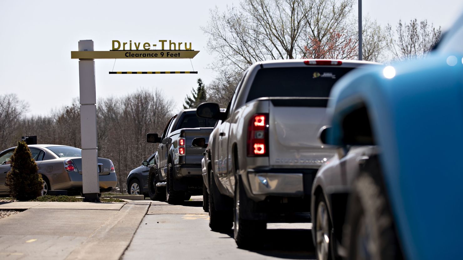 Customers wait in the drive-thru at a McDonald's restaurant in Peru, Illinois, in April 2020. 