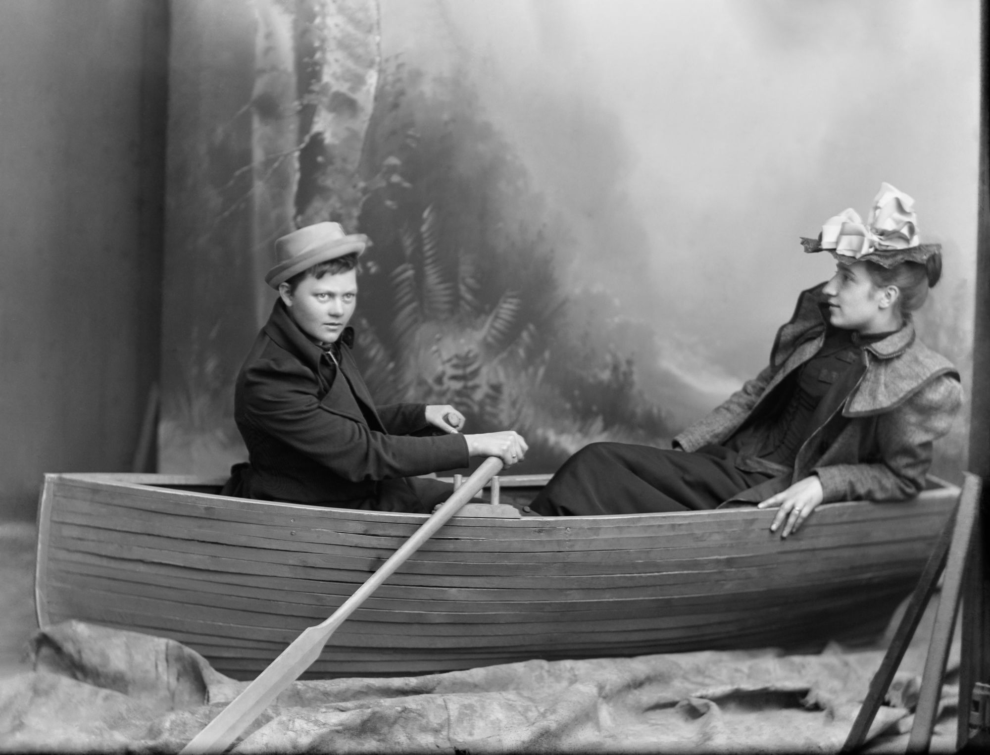Berg & Høeg, "Water scene". Marie Høeg and Bolette Berg in a rowing boat in the studio, 1894-1903.