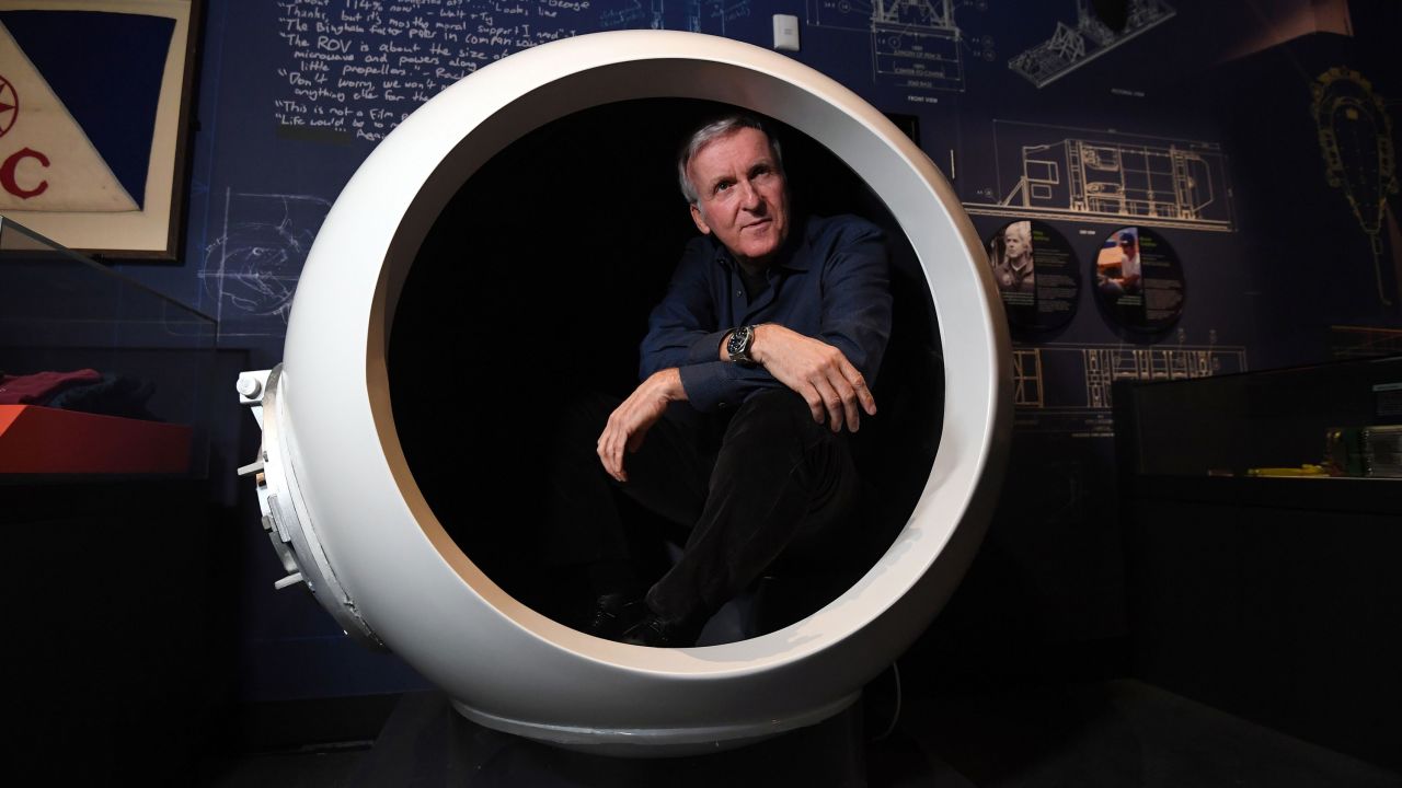 TOPSHOT - Deep-sea explorer and Academy Award-winning filmmaker James Cameron sits in a scale model of the Deepsea Challenger's pilot chamber at an exhibition about his history-making deep-sea expeditions in Sydney on May 28, 2018. - James Cameron will officially open a new exhibition "James Cameron - Challenging the Deep" at the Australian National Maritime Museum starting on May 29. (Photo by Saeed KHAN / AFP)        (Photo credit should read SAEED KHAN/AFP via Getty Images)