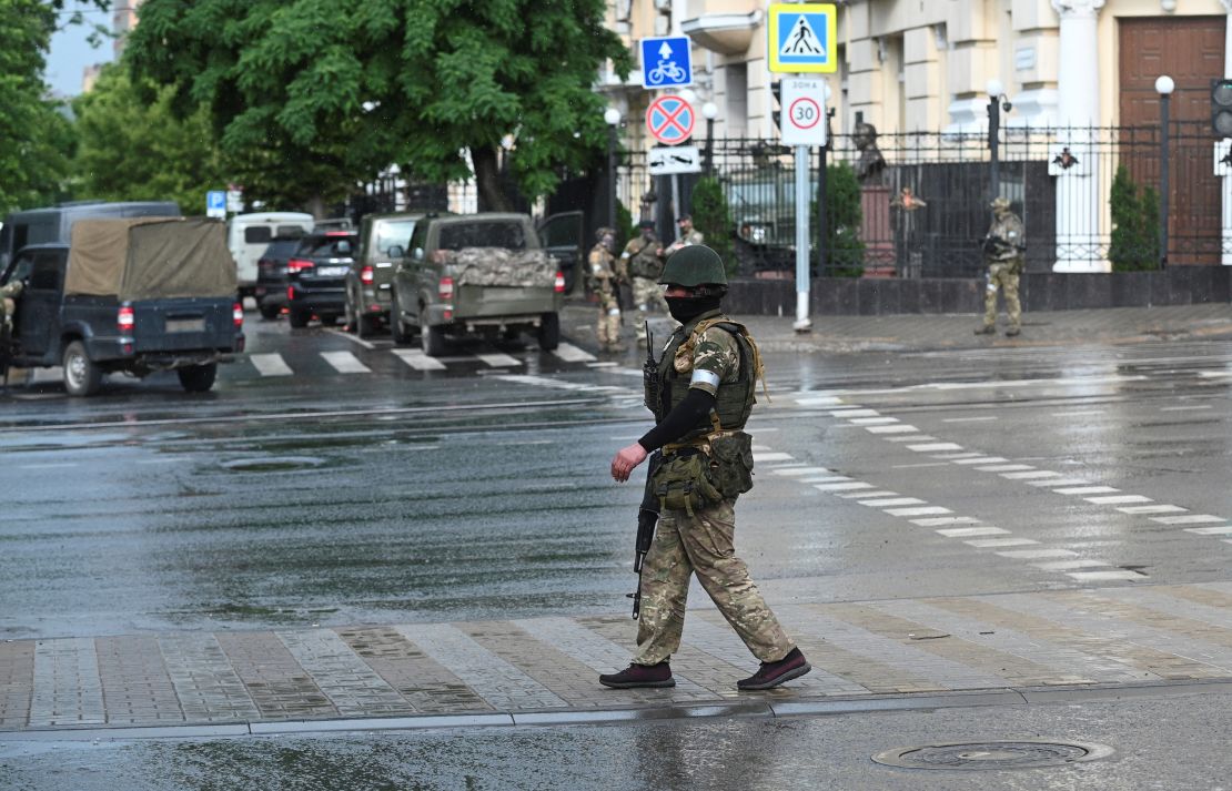 Fighters of Wagner private mercenary group stand guard in a street near the headquarters of the Southern Military District in the city of Rostov-on-Don, Russia, June 24, 2023. REUTERS/Stringer