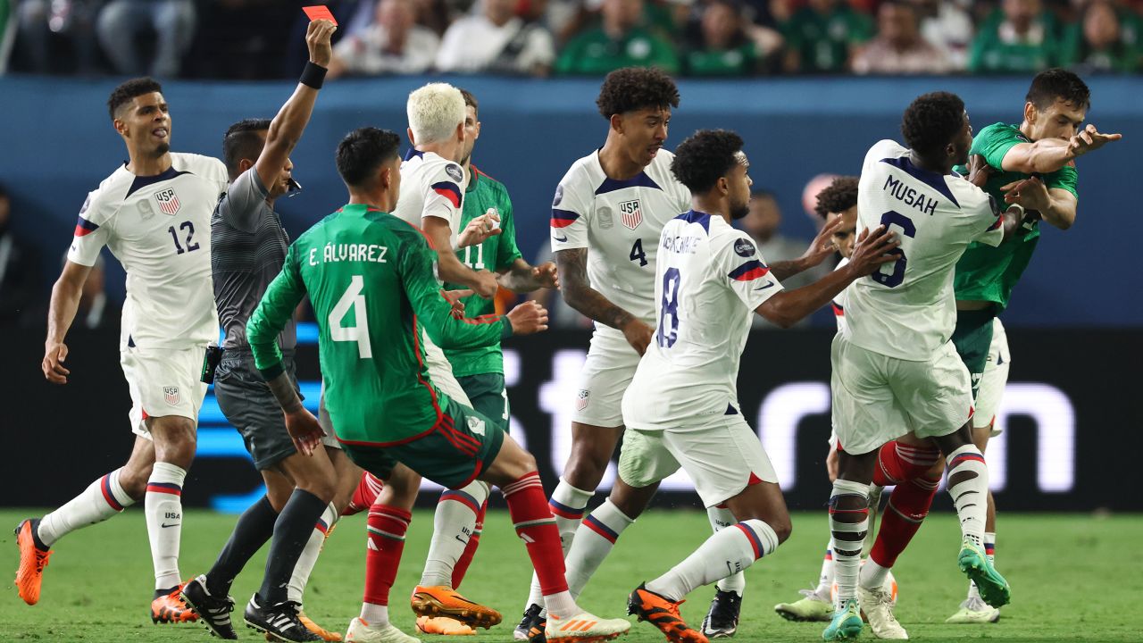 Cesar Montes of Mexico clashes with Yunus Musah of USA as Referee Ivan Barton from El Salvador shows his red card during the CONCACAF Nations League Semi Final between Mexico and United States of America at Allegiant Stadium on June 15, 2023 in Las Vegas, Nevada.