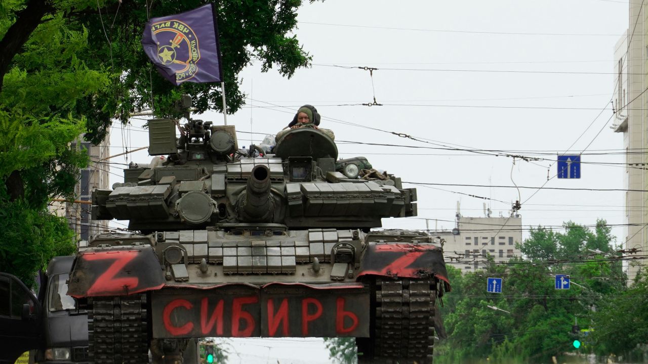 Members of Wagner group sit atop of a tank in a street in the city of Rostov-on-Don, on June 24, 2023.