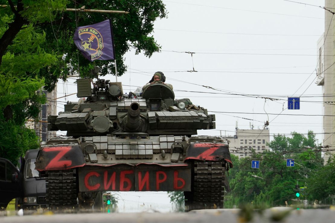 Members of Wagner group sit atop of a tank in a street in the city of Rostov-on-Don, on June 24, 2023. 