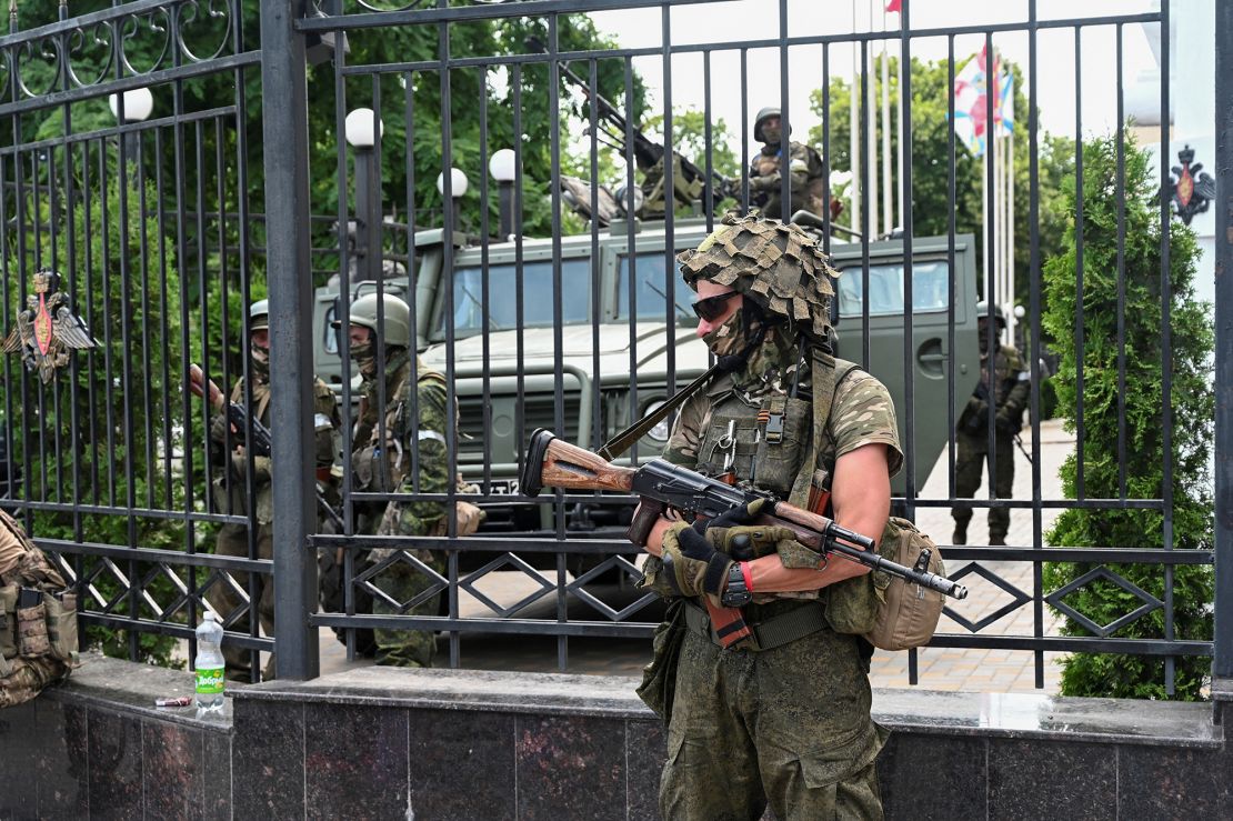 Fighters of Wagner private mercenary group stand guard outside the headquarters of the Southern Military District in the Russian city of Rostov-on-Don on June 24, 2023.