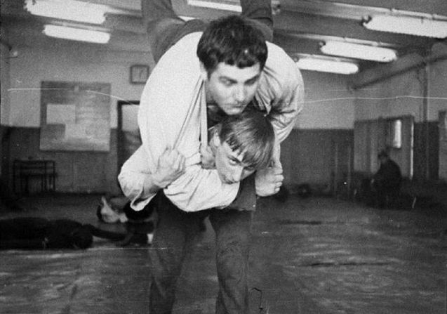 Putin, bottom, wrestles at school in St. Petersburg in 1971.