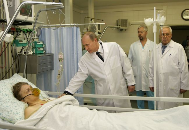 Putin meets with a victim of a terrorist attack at a Moscow hospital in March 2010.  Two suicide bombers blew themselves up on packed metro trains in Moscow, killing dozen of people.