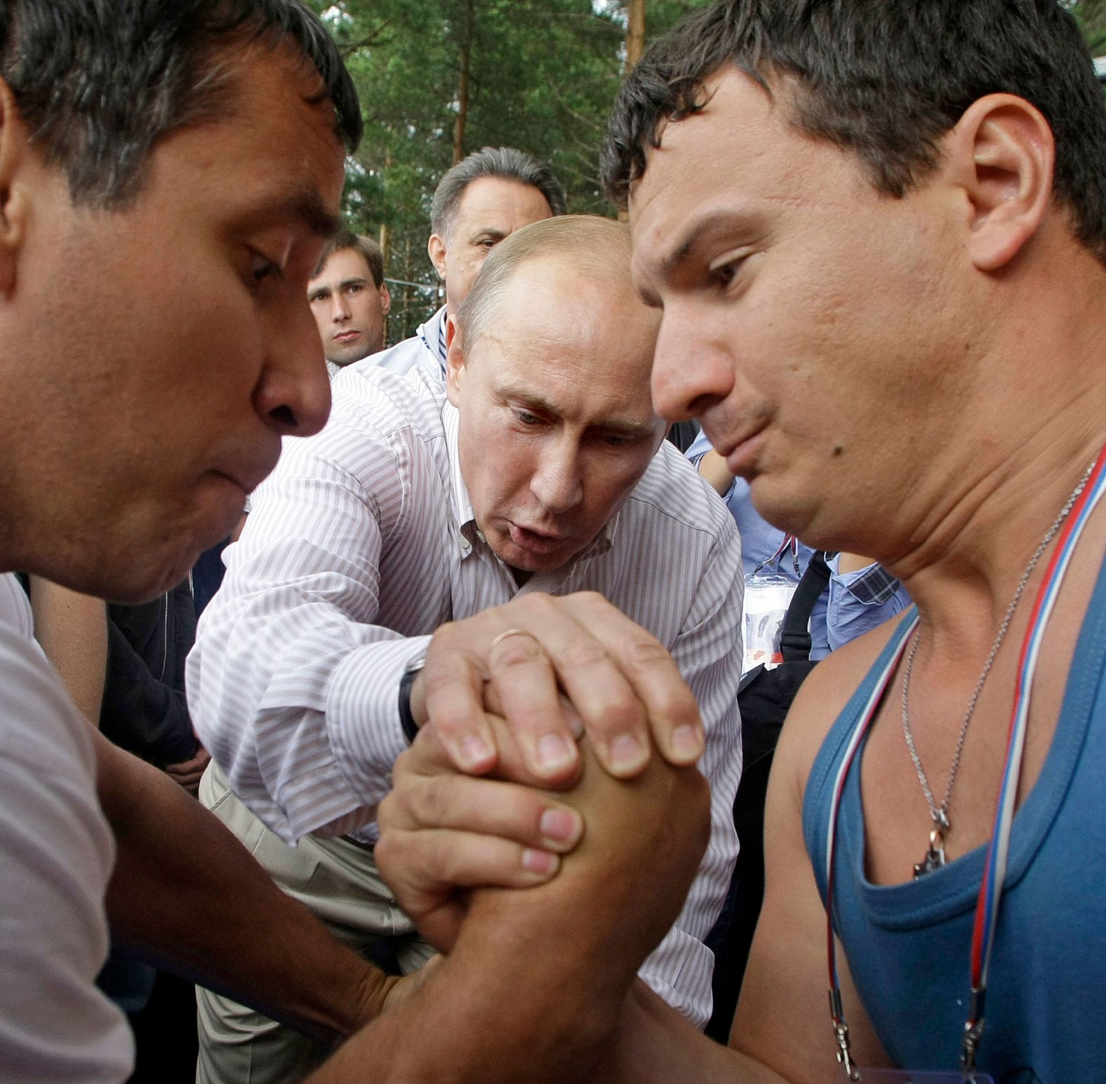 Putin judges an arm wrestling match while visiting the Seliger youth educational forum in Russia's Tver region in August 2011.