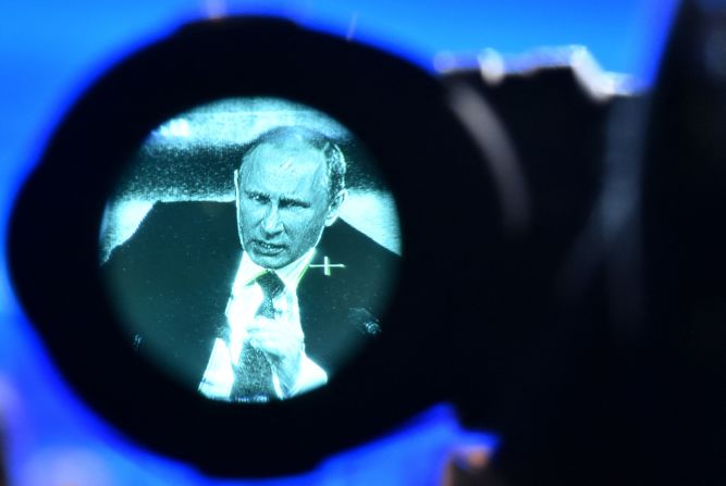 Putin is seen through a video camera's viewfinder as he speaks during his annual news conference in Moscow in December 2014.