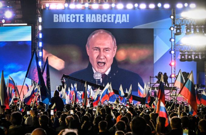 Putin is seen on a screen as he addresses a rally and concert in Moscow marking the annexation of the four regions of Ukraine in September 2022.