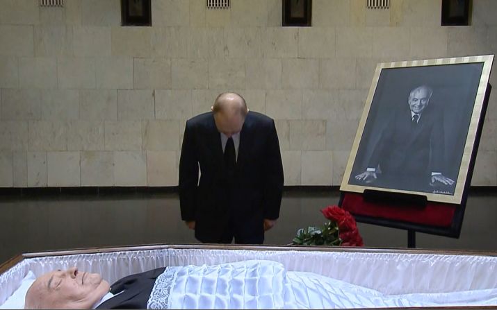 In this image taken from video, Putin pays his respects near the coffin of former Soviet President Mikhail Gorbachev at the Central Clinical Hospital in Moscow in September 2022.