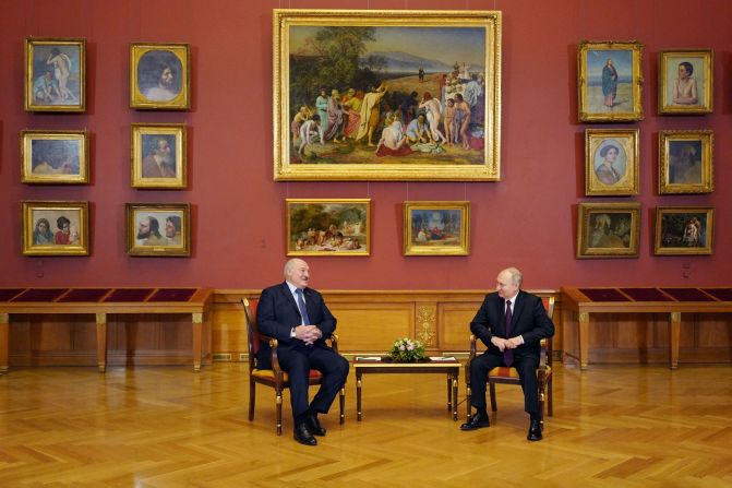 Putin speaks with his Belarus counterpart Alexander Lukashenko during a meeting at the State Russian Museum in St. Petersburg in December 2022.