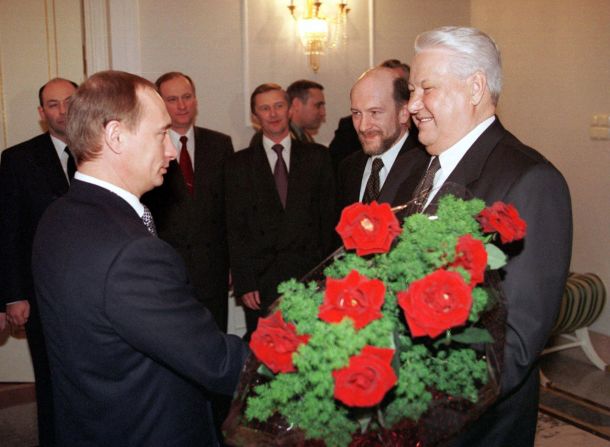 Russian President Boris Yeltsin appointed Putin prime minister in 1999. Here, Putin hand Yeltsin flowers during a farewell ceremony at the Kremlin in Moscow in December 1999. Amid a scandal Yeltsin had announced he was resigning immediately and that Putin would run the country as acting president until elections in March 2000.