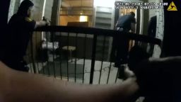 A still from body camera video released by the San Antonio Police Department shows police firing into the apartment of Melissa Ann Perez.