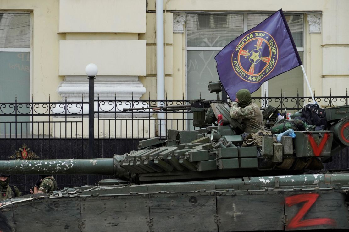 Members of Wagner group sit atop of a tank in a street in the city of Rostov-on-Don, southern Russia, on June 24, 2023.