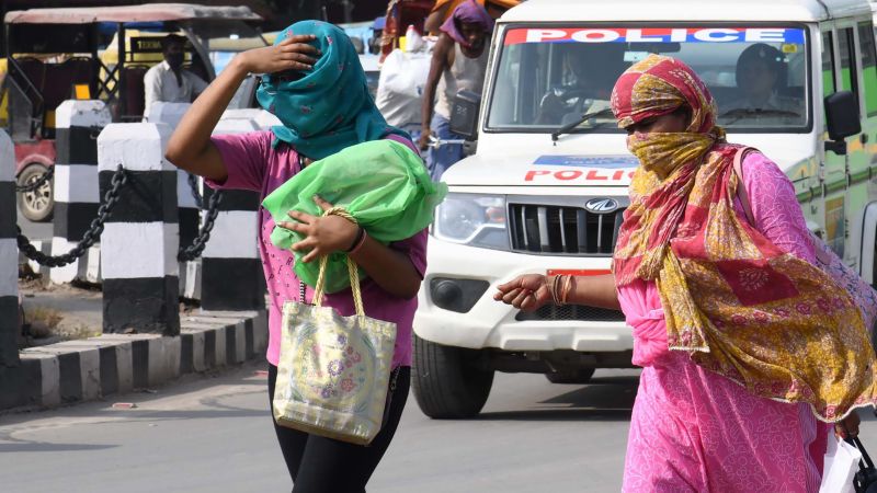 NextImg:Humans approaching limits of 'survivability' as sweltering heatwaves engulf parts of Asia | CNN